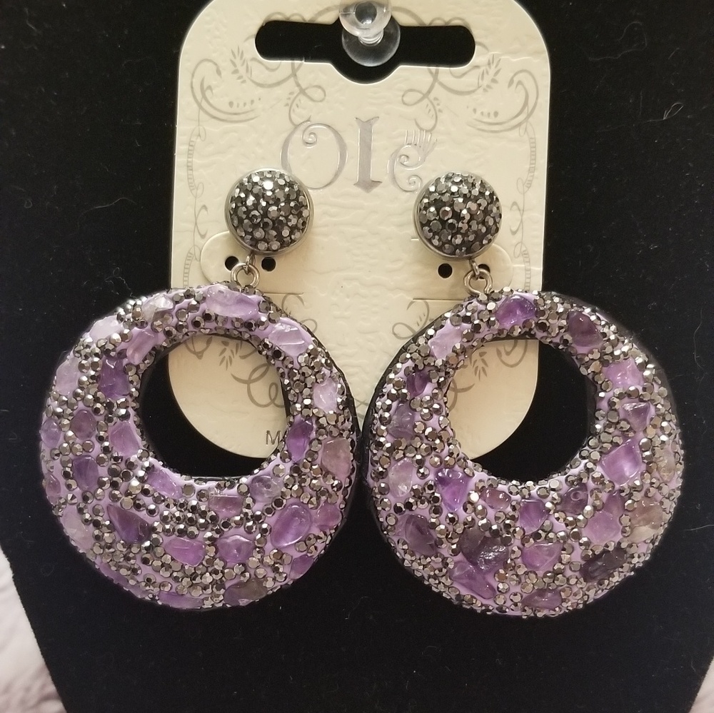 Purple and rhinestone dangle earrings.